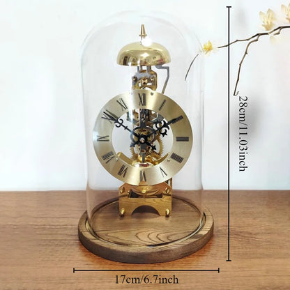Glass dome clock - Stanley: A vintage-style tabletop clock with exposed brass gears, Roman numeral dial, and a chime bell, elegantly encased under a clear glass dome on a wooden base.