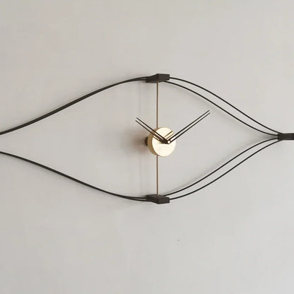 Large decorative wall clock mounted above white living room console table