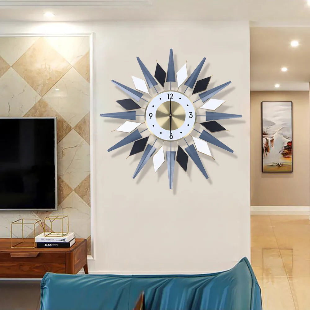 Big Decorative Wall Clocks - Denley: A striking-style clock with alternating blue-gray, black, and white triangular rays, adding a bold, mid-century flair to a contemporary living space.