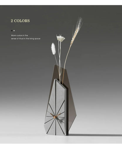 Desk clock styled with dried flowers and decorative stems in home office vignette