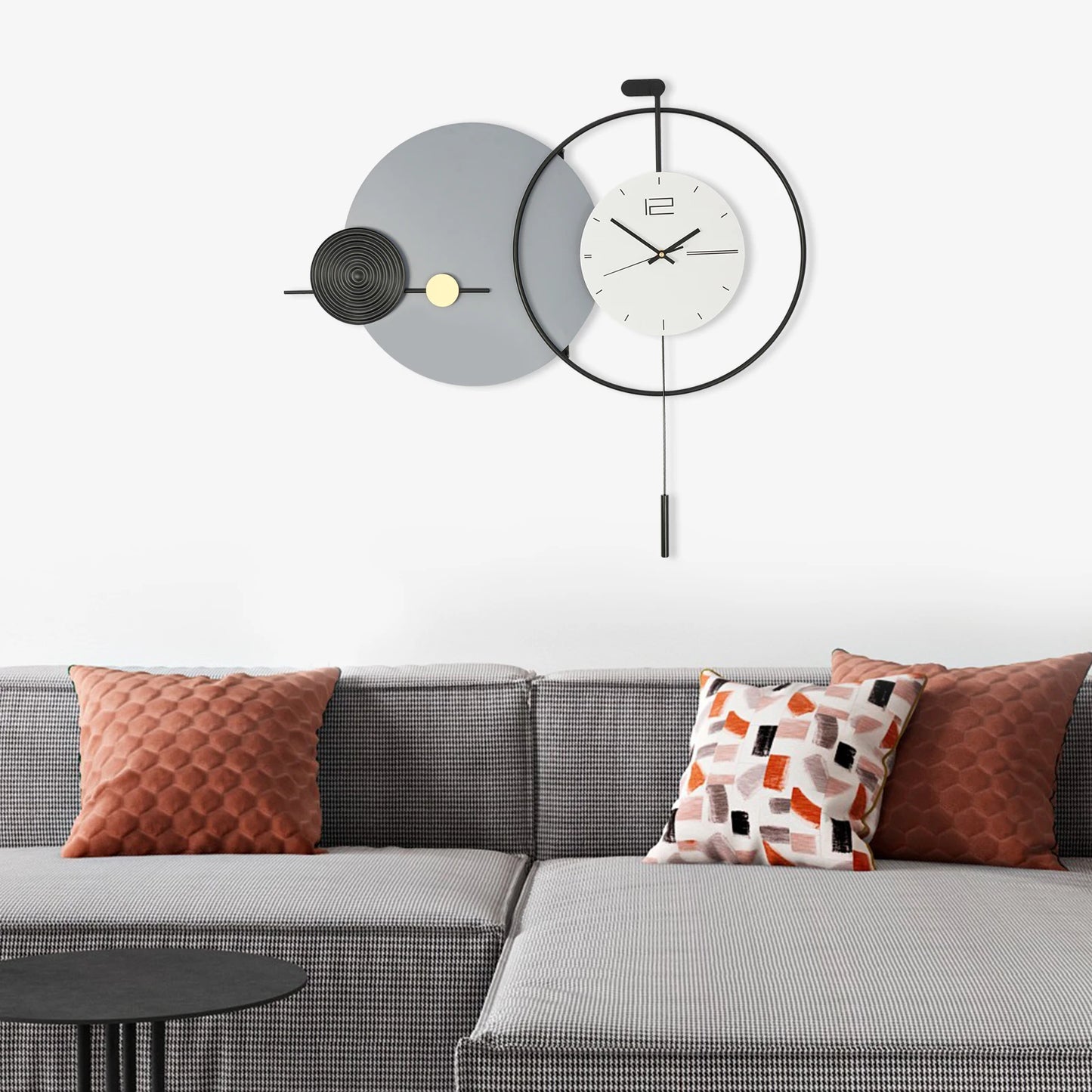 Big Wall Clock Modern - Darrington: A striking geometric clock with a white face and overlapping metal circles, featuring a slim pendulum, perfectly complements the minimalist aesthetic of contemporary interiors.