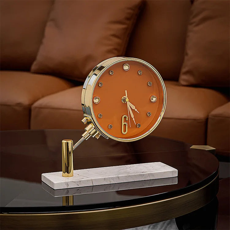 Luxury Table Clock - Corlen: A sophisticated timepiece featuring an orange face with crystal hour markers, gold-tone bezel, and marble base, perfect for enhancing modern home or office decor.