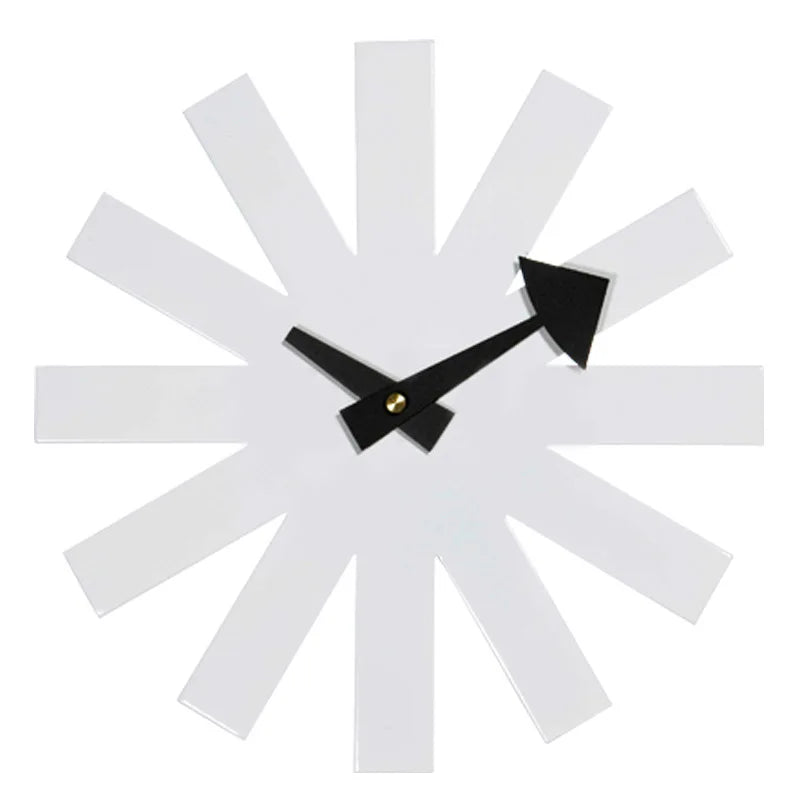 Black decorative clock in modern bedroom with neutral gray walls and wood furniture