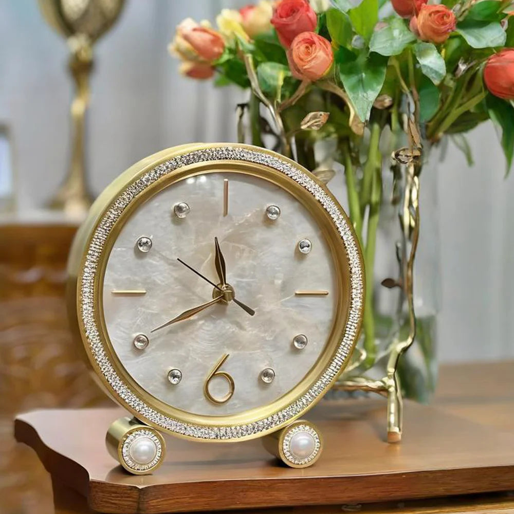 Silent Table Clock - Feynor: A gold-trimmed, crystal-studded round clock with a marble-look face, minimalist markers, faux-pearl accents, perfect for elevating any space with its contemporary elegance.