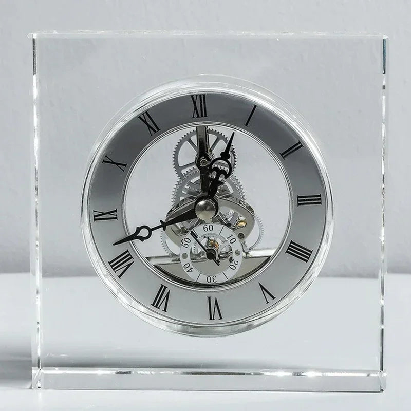 Crystal tabletop clock - Dunley: A striking freestanding desk clock encased in clear glass, showcasing Roman numerals, ornate hands, and visible metal gears, blending modern elegance with intricate craftsmanship.