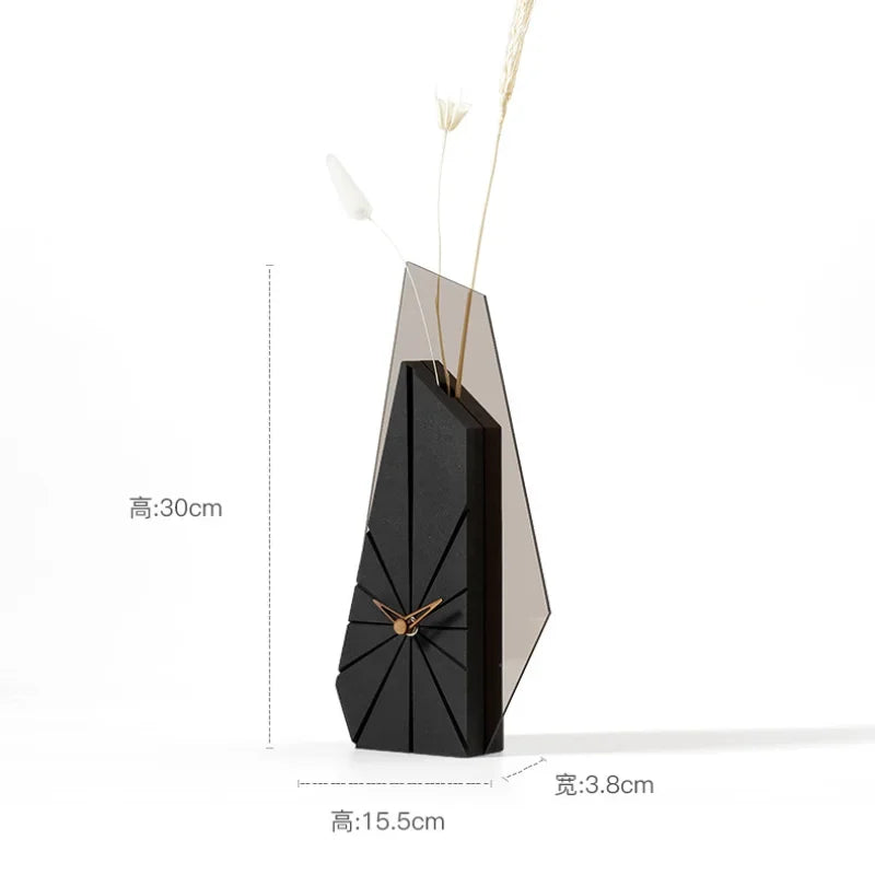 Design desk clock scaled next to decorative objects on modern console surface