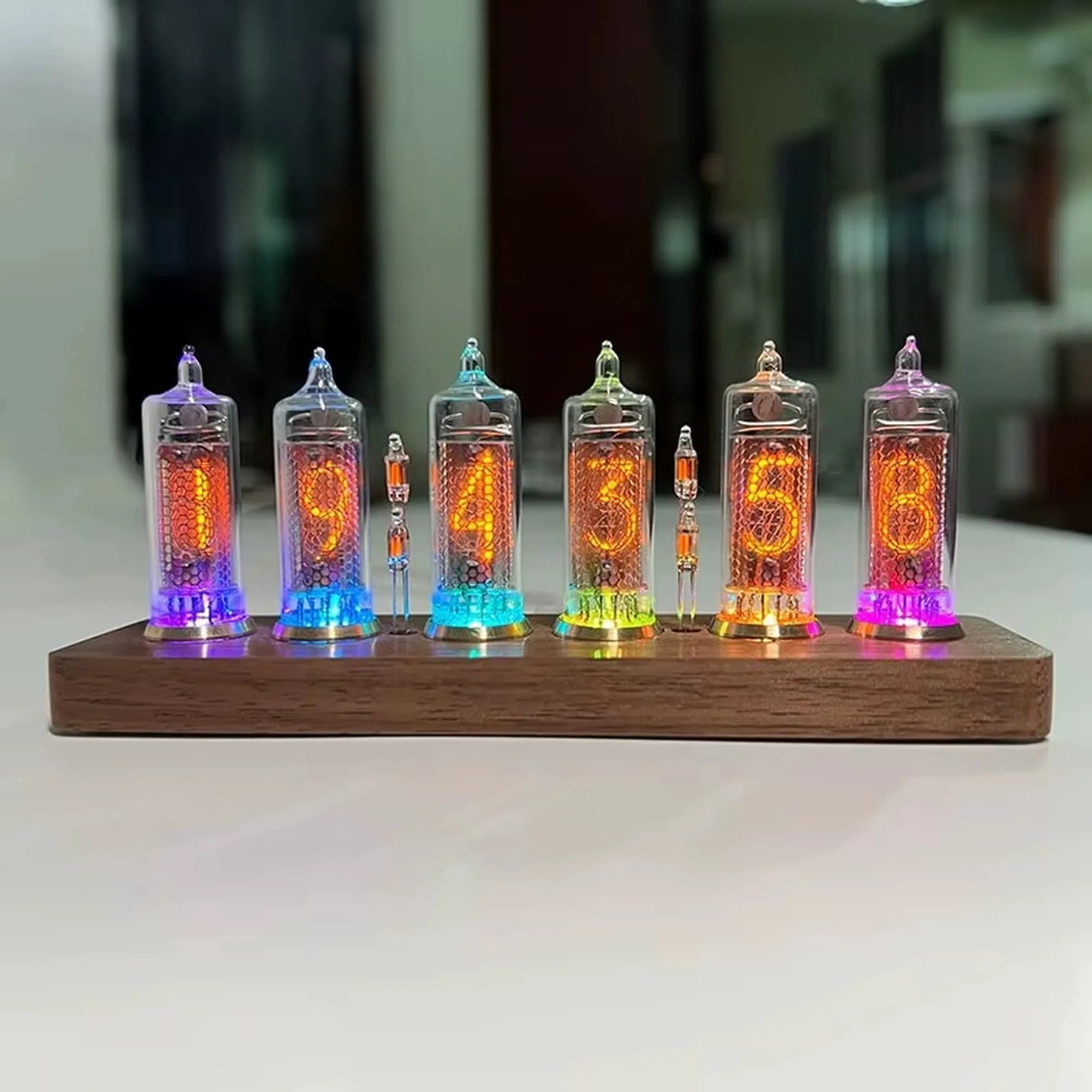 Nixie tube clock - Hartley, featuring six glowing glass tubes on a wooden base, displays time 19:43:53. A fusion of vintage technology and modern design, ideal for desks or shelves.