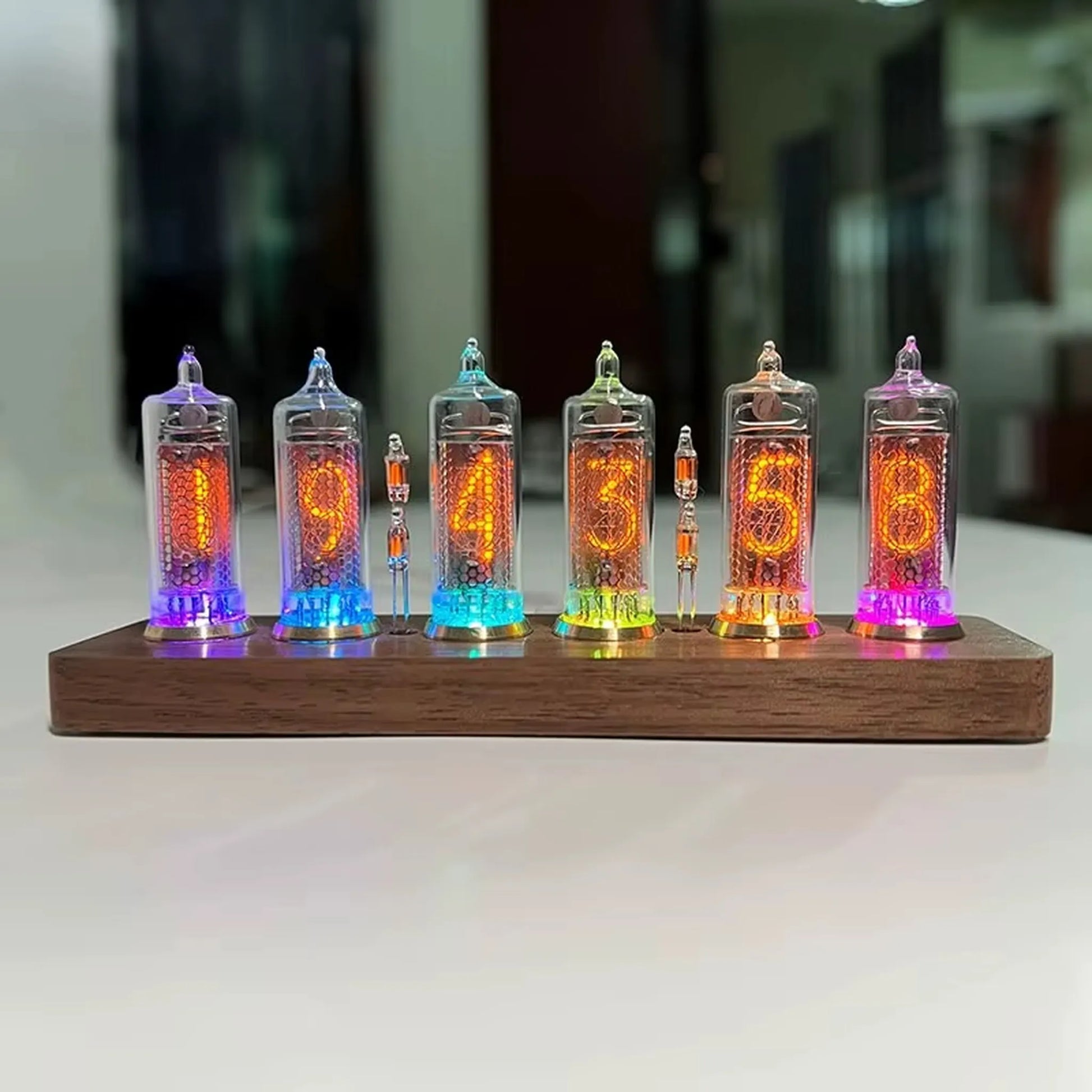 Nixie tube clock - Hartley, featuring six glowing glass tubes on a wooden base, displays time 19:43:53. A fusion of vintage technology and modern design, ideal for desks or shelves.