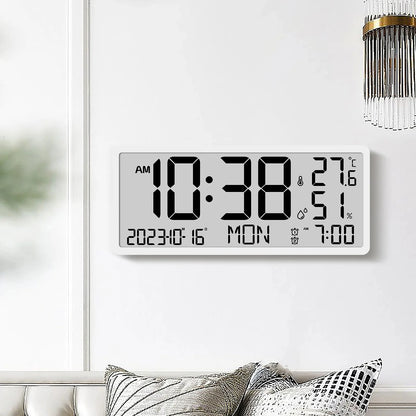 White Digital Clock - Carradon mounted on a minimalist wall, displaying time, date, temperature, humidity, and alarm settings. Positioned above a sofa with cushions, capturing modern design simplicity.