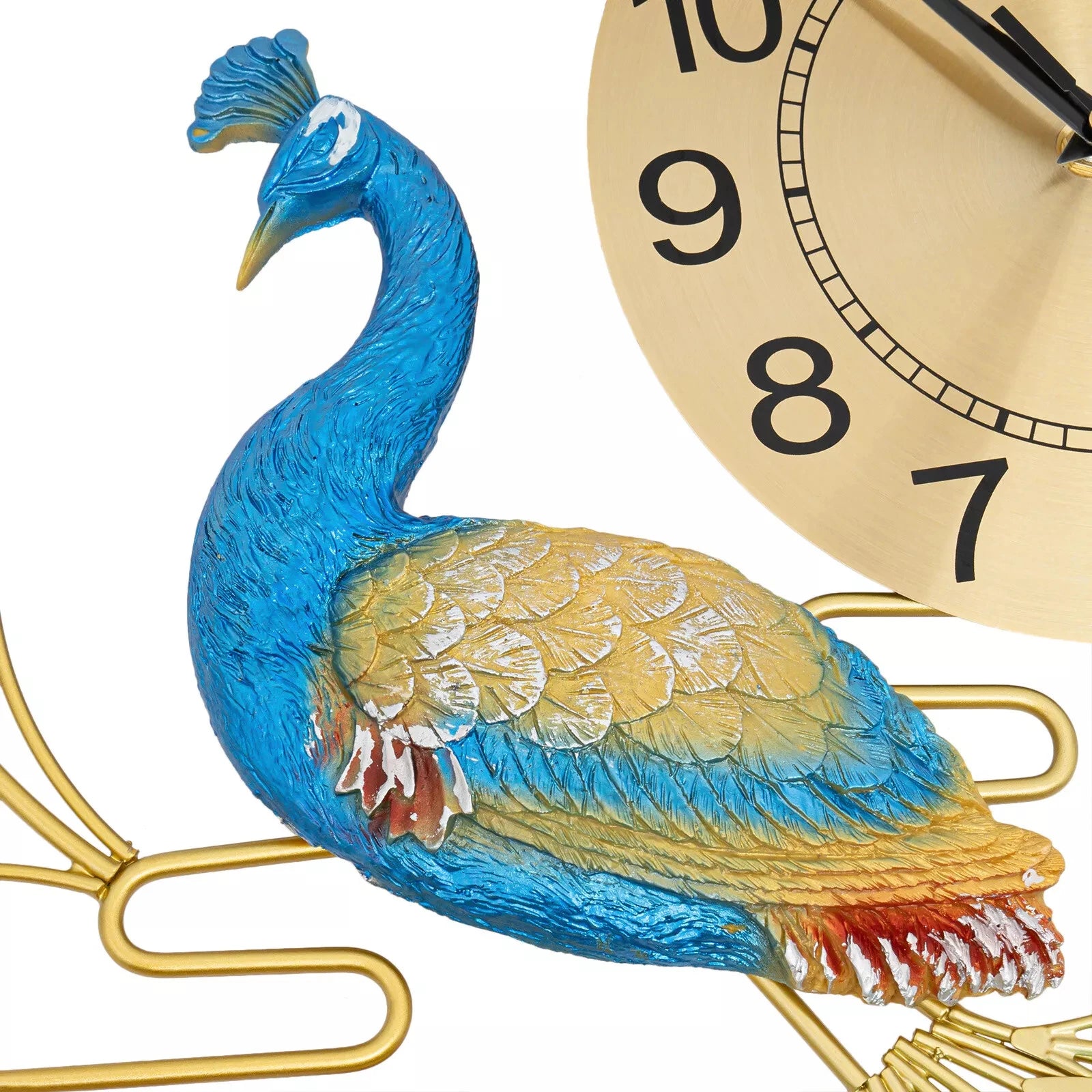 Close-up of Peacock Wall Clock - Wexley, featuring a sculpted peacock with intricate blue and gold details and shimmering crystals, set against a gold-tone clock face with black numerals.