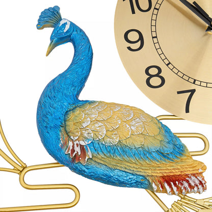 Close-up of Peacock Wall Clock - Wexley, featuring a sculpted peacock with intricate blue and gold details and shimmering crystals, set against a gold-tone clock face with black numerals.