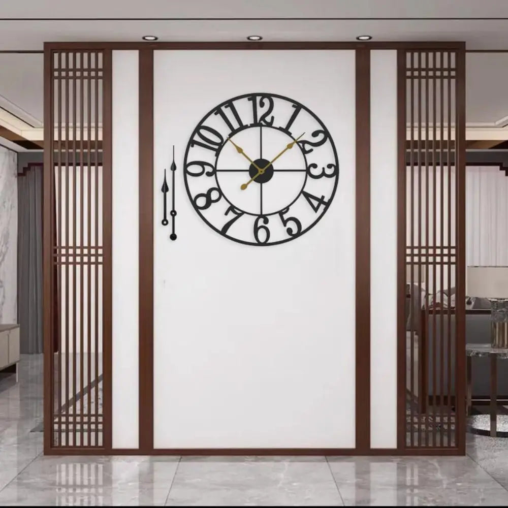 Oversized Wall Clock - Alderton features a black metal frame with a distressed finish, visible moving gears, and gold-tone hands, providing a striking visual centerpiece against a white partition wall.