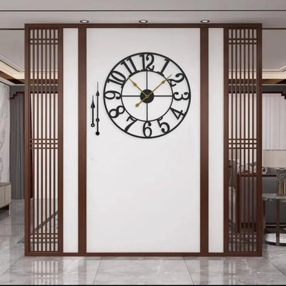 Oversized Wall Clock - Alderton features a black metal frame with a distressed finish, visible moving gears, and gold-tone hands, providing a striking visual centerpiece against a white partition wall.