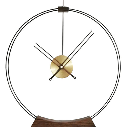 Design table clock - Bexley: A minimalist clock featuring a thin metal ring dial, brass-colored hub, and black hands, supported by a slim rod on a curved wooden base, epitomizing contemporary elegance.