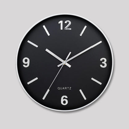 Modern Silent Wall Clock - Densford: A sleek, minimalist wall clock with a black face, slim white/silver bezel, and silent quartz movement, featuring numerals at 12, 3, 6, and 9.
