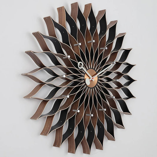 Wall Clock Decor - Jerrington features a design petals ensemble shaped wooden slats and a small circular dial, embodying mid-century modern style, perfect for adding warmth to your space.