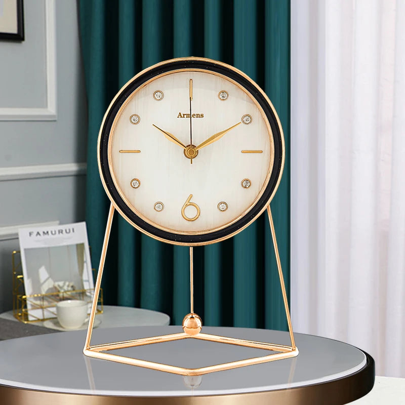 Pendulum Table Clock - Dralen features a round face with gold hands and crystal markers, framed in black and gold, on a triangular gold stand, offering elegant, modern timekeeping.
