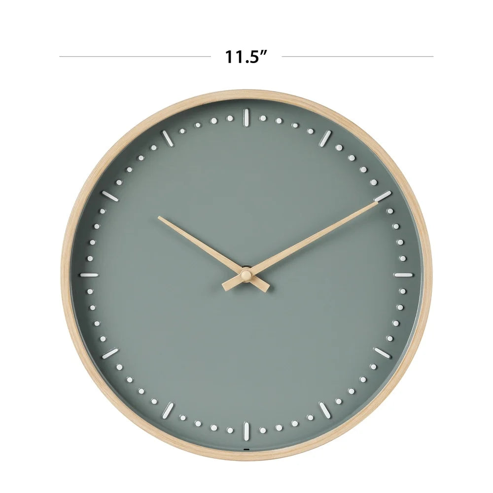 Small modern wall clock - Merrin features a minimalist design with a light wood frame and muted blue-green face. White inset markers and wood-tone hands deliver subtle elegance, ideal for any room.