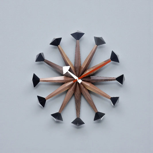 Decorative wall clocks modern - Drayen: A mid-century–style wall clock with wooden spokes, geometric caps, and contrasting hour hands, ideal for contemporary spaces
