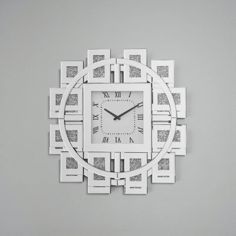 Decorative mirror wall clock - Stratton, featuring a square face with Roman numerals, slim hands, and a circular mirrored frame with geometric panels, adding a modern, glamorous touch to interiors.