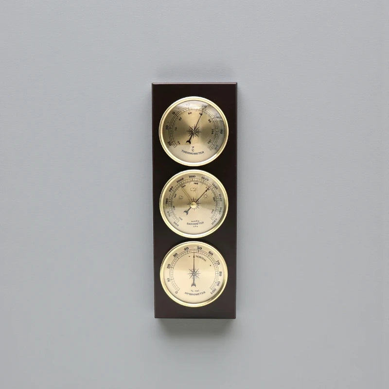 Weather Station Wall Clock - Harlton: A wall-mounted unit featuring an analog thermometer, barometer, and hygrometer set in dark wood with brass-rimmed dials, offering a sophisticated touch for time and environmental monitoring.
