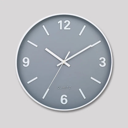 Modern Silent Wall Clock - Densford: A minimalist analog clock with a gray face, white frame, bold numerals at 12, 3, 6, 9, and silent non-ticking quartz movement, enhancing any room's elegance.