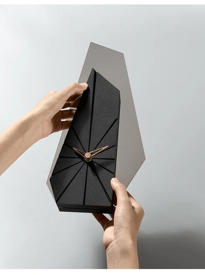 Smoky gray acrylic desk clock reflecting ambient evening lighting in living room