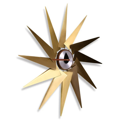 Decorative wall clock with design in gold and bronze on a white background