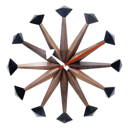 Decorative wall clocks modern - Drayen: A mid-century modern design with twelve wooden spokes, each ending in black geometric tips, and simple hands