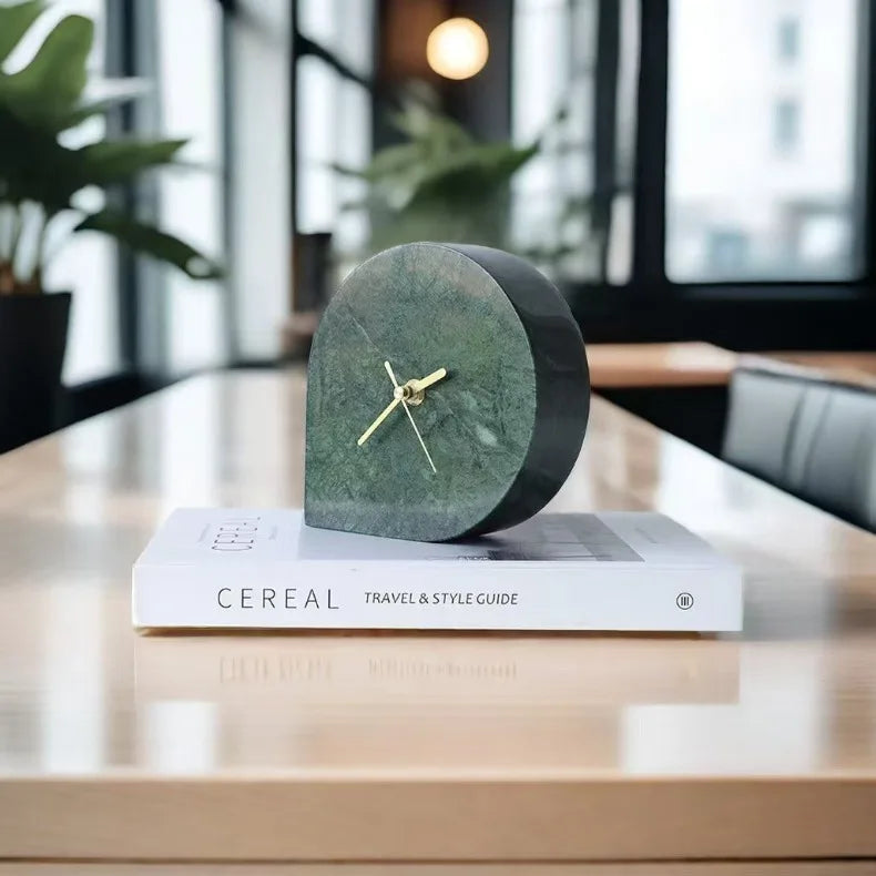 White marble mantel clock styled on bedroom nightstand