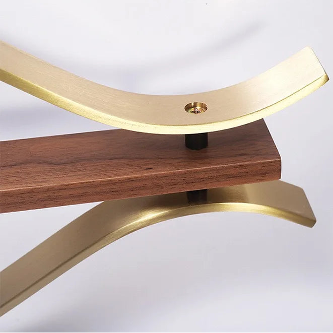 30-inch decorative wall clock - Ashen, featuring brass-tone metal bars and a wooden block, showcases industrial style. Detailed hardware adds vintage charm, aligning with The Horologista's focus on striking timepieces.