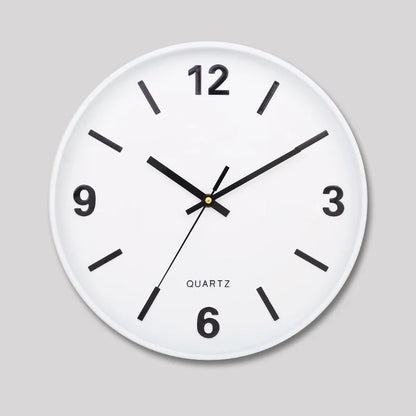Modern Silent Wall Clock - Densford: A minimalist round white quartz wall clock featuring black hands and hour markers, with numerals at 12, 3, 6, and 9, offering silent, non-ticking elegance.