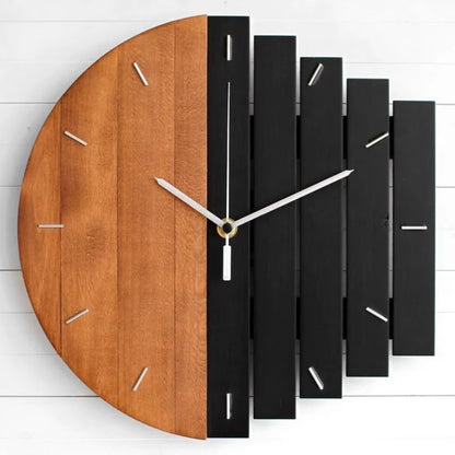 Modern wood wall clock - Clevor, featuring a split design with natural and matte black slatted-wood halves, metal hour markers, and three slim metal hands, crafted for spacious interiors.