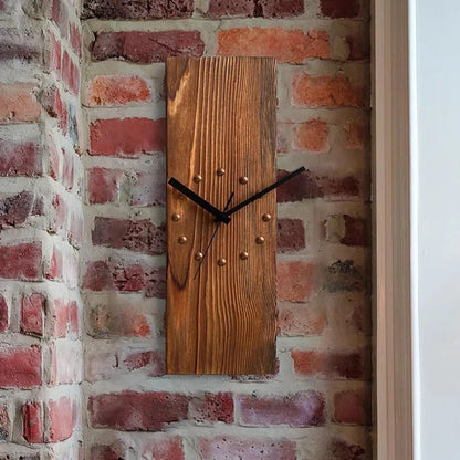 Wood Wall Clock - Stalford features a rustic design with a stained wood plank and metal studs marking hours, complemented by slim black hands, perfectly suited for large, curated spaces.