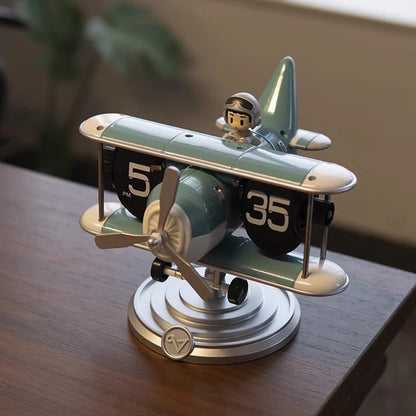 Turquoise blue airplane flip clock with pilot figure detail