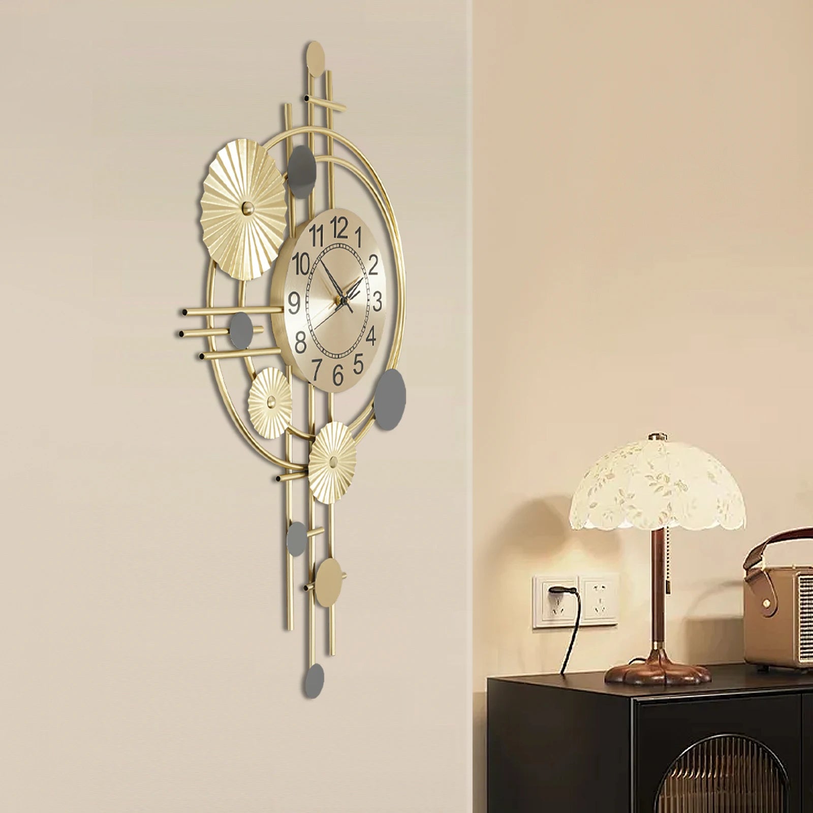 Oversized wall clock modern - Ashford: A stylish gold-tone wall clock with intersecting rods and concentric rings, featuring floating black numerals and silent brass hands, integrates artfully into the decor.