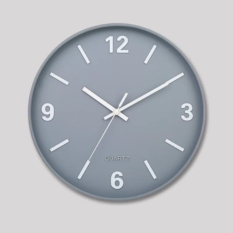 Modern Silent Wall Clock - Densford features a grey face with large white numerals and bar markers, complemented by white hands, embodying minimalist elegance with a silent quartz movement, ideal for contemporary decor.