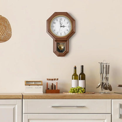 Vintage wall clock pendulum - Heritage: A wall-mounted wooden clock with an octagonal frame and pendulum, adding timeless elegance to a kitchen countertop styled with kitchen essentials.