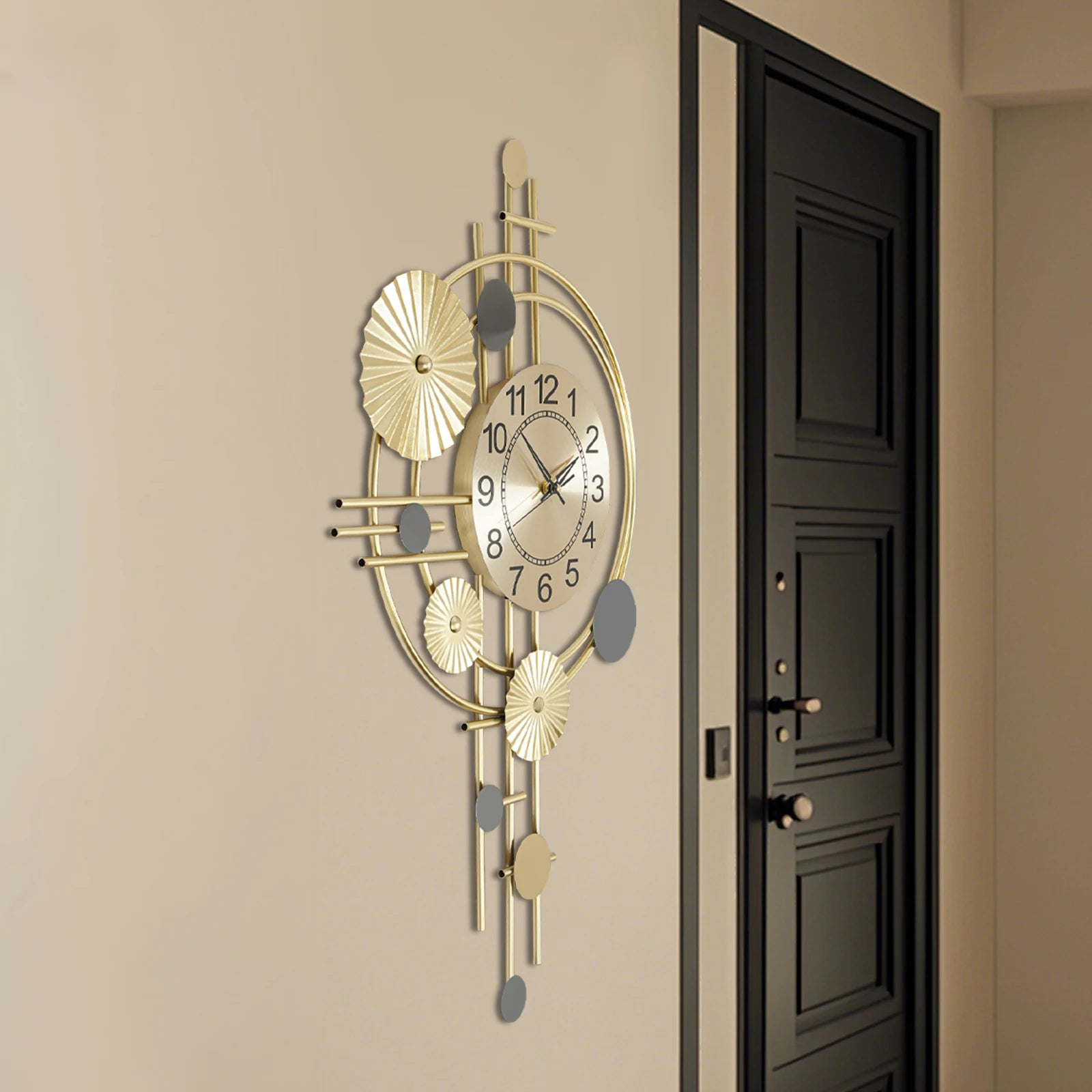 Oversized wall clock modern - Ashford: A 17.7 gold steel ring with floating black numerals and brass hands, featuring a sculptural design that integrates the wall color into its open-face dial.