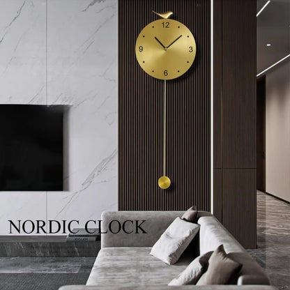 Modern pendulum wall clock - Majesty on a dark wood accent wall, featuring a gold round face and bird figurine, complements a minimalist Nordic living room with a sleek sectional sofa.