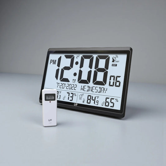 Atomic wall clock - Harven: Tabletop digital clock/weather-station with large LCD displaying time, date, indoor/outdoor temperature, humidity, and wireless sensor module for precise, atomic-synced timekeeping.
