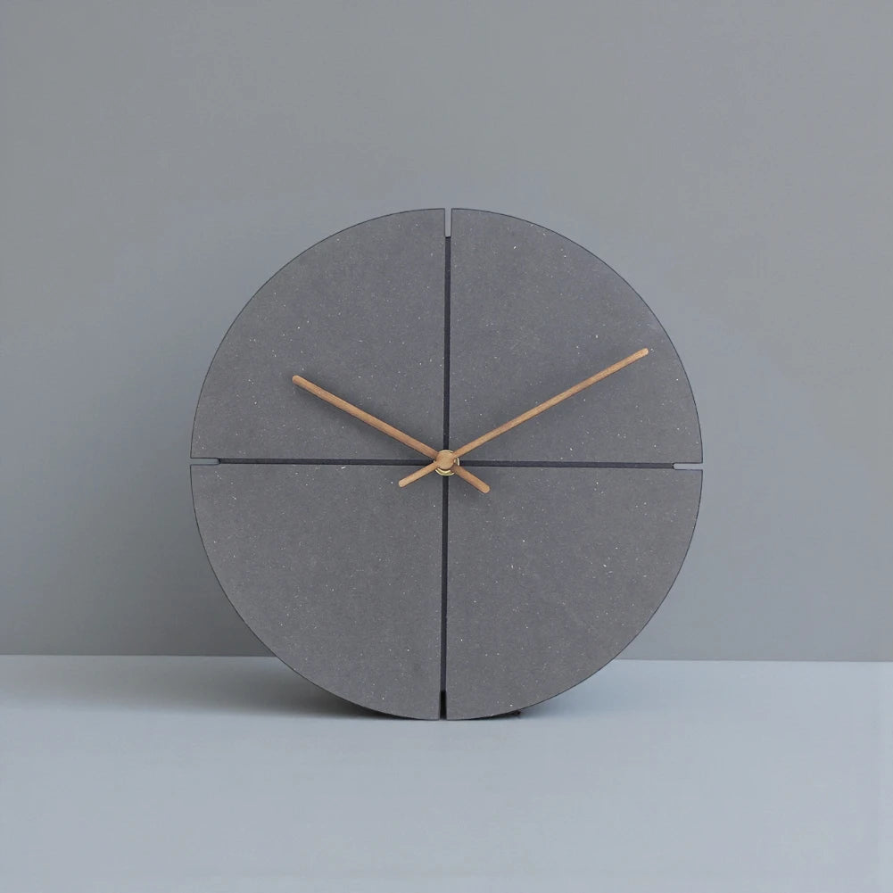 Deep Black Wall Clock Modern - Grenton features a minimalist dark-grey design with a circular face, slender hands, and a sophisticated stone-like finish, perfect for a modern urban aesthetic.