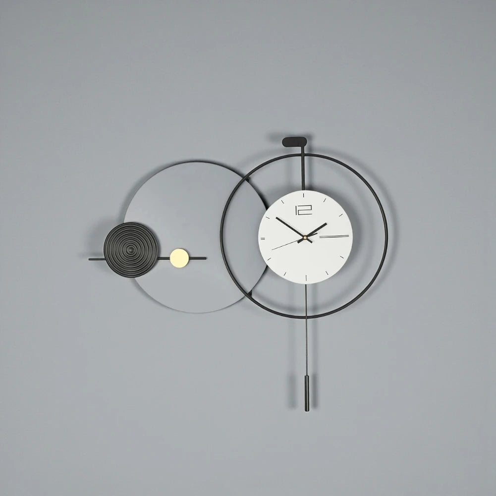 Big Wall Clock Modern - Darrington features overlapping metal rings with a minimalist clock face and slender pendulum, offering a sleek, functional design ideal for contemporary spaces from The Horologista.