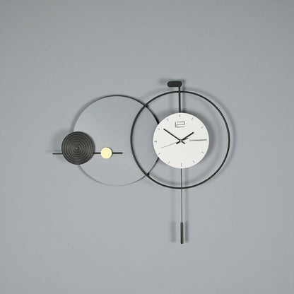 Big Wall Clock Modern - Darrington features overlapping metal rings with a minimalist clock face and slender pendulum, offering a sleek, functional design ideal for contemporary spaces from The Horologista.