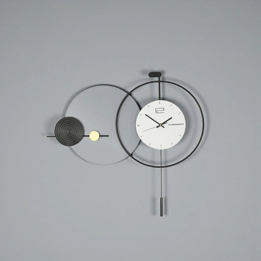 Big Wall Clock Modern - Darrington features overlapping metal rings with a minimalist clock face and slender pendulum, offering a sleek, functional design ideal for contemporary spaces from The Horologista.