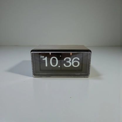 Vintage flip clock - TimeFlip with a black rectangular body and clear front, displaying white numerals 10:36 AM. A retro timepiece, perfect for adding a classic touch to any space.