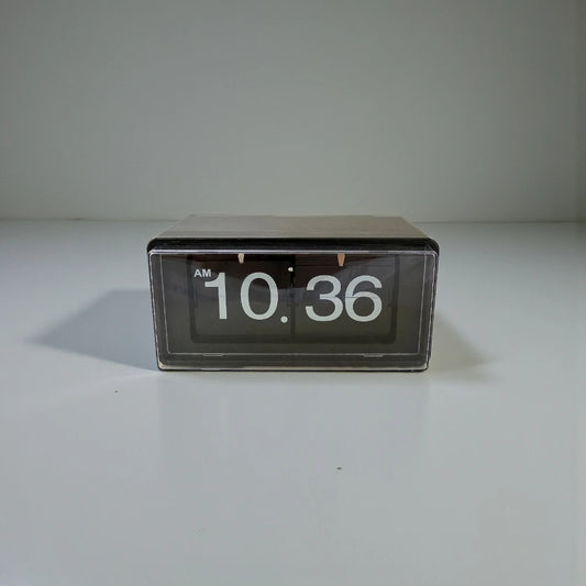 Vintage flip clock - TimeFlip with a black rectangular body and clear front, displaying white numerals 10:36 AM. A retro timepiece, perfect for adding a classic touch to any space.