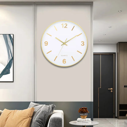 Modern Silent Wall Clock - Densford with a white face and gold frame, prominently displayed on a stylish corner wall, enhancing the contemporary elegance of the minimalist room setting.