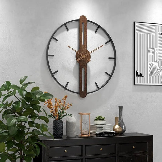 Modern Walnut & Steel Wall Clock by Largolck: A 27.6-inch open-face clock showcasing a metal ring with a wooden centerpiece and brass hands, atop a stylish console with vases and books.