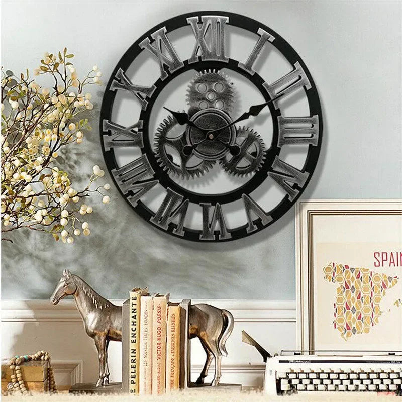 Large gear wall clock - Bevington, featuring an open-face design with exposed gears and oversized Roman numerals, mounted above a vintage-industrial display with horse bookends, a typewriter, and decor accents.